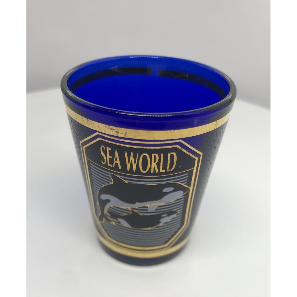 SEA WORLD COLLECTIBLE SHOT GLASS Cobalt Blue SeaWorld Shot Glass Gold Tone Trim